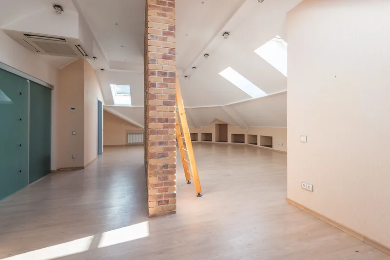 A cabinet run held below a low ceiling