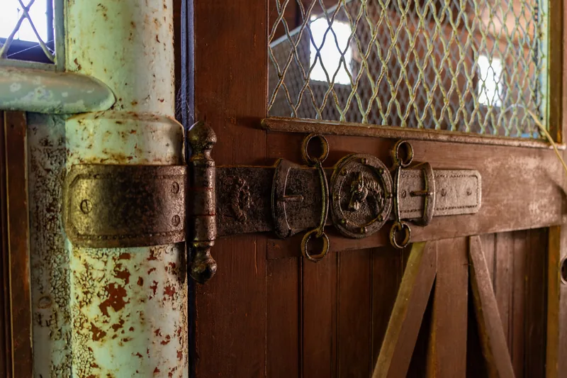 A cabinet hinge being adjusted
