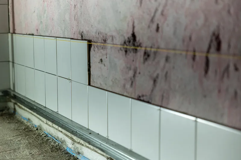 Anchoring cabinetry into a masonry wall