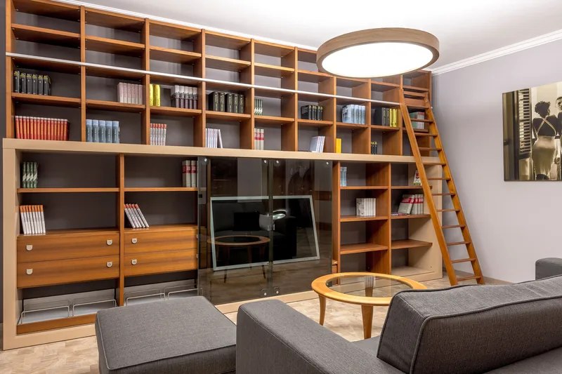 A library ladder rail on a tall bookcase